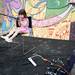 Three-year-old Ryen Mahoney, daughter of Neutral Zone Board President Tara, sings into a microphone on the acoustic stage during the Live on Washington Music and Arts Festival on Saturday, June 1. Daniel Brenner I AnnArbor.com